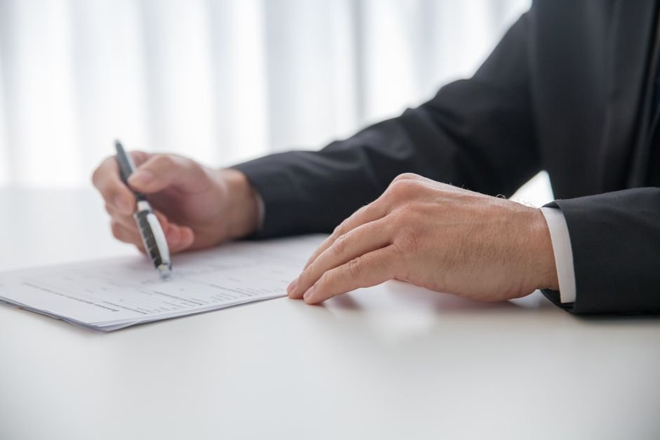 Legal paperwork and a pen on a desk